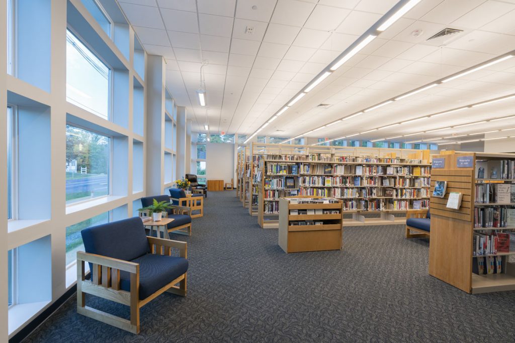 Wolfeboro Library window with stacks