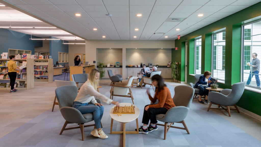 Cafe seating area with windows and daylighting at North Hampton Public Library