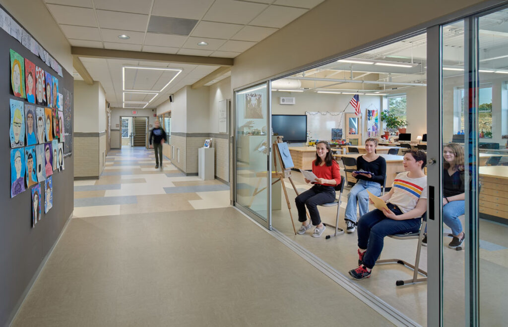 A photo of an art classroom and observation hallway at Morse High School