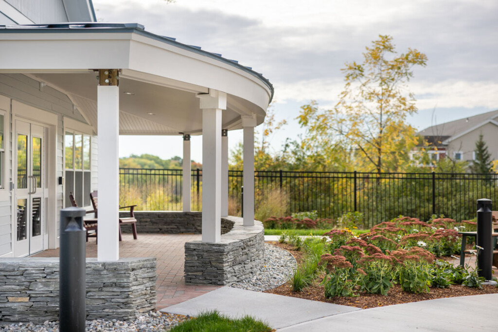 Outdoor covered patio that looks out over scenic trees