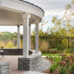Contextual Image that shows a stone porch with a patio that leads into a secure courtyard.